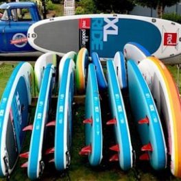 a group of lawn chairs sitting on top of a surfboard