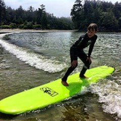 a man on a surf board on a body of water