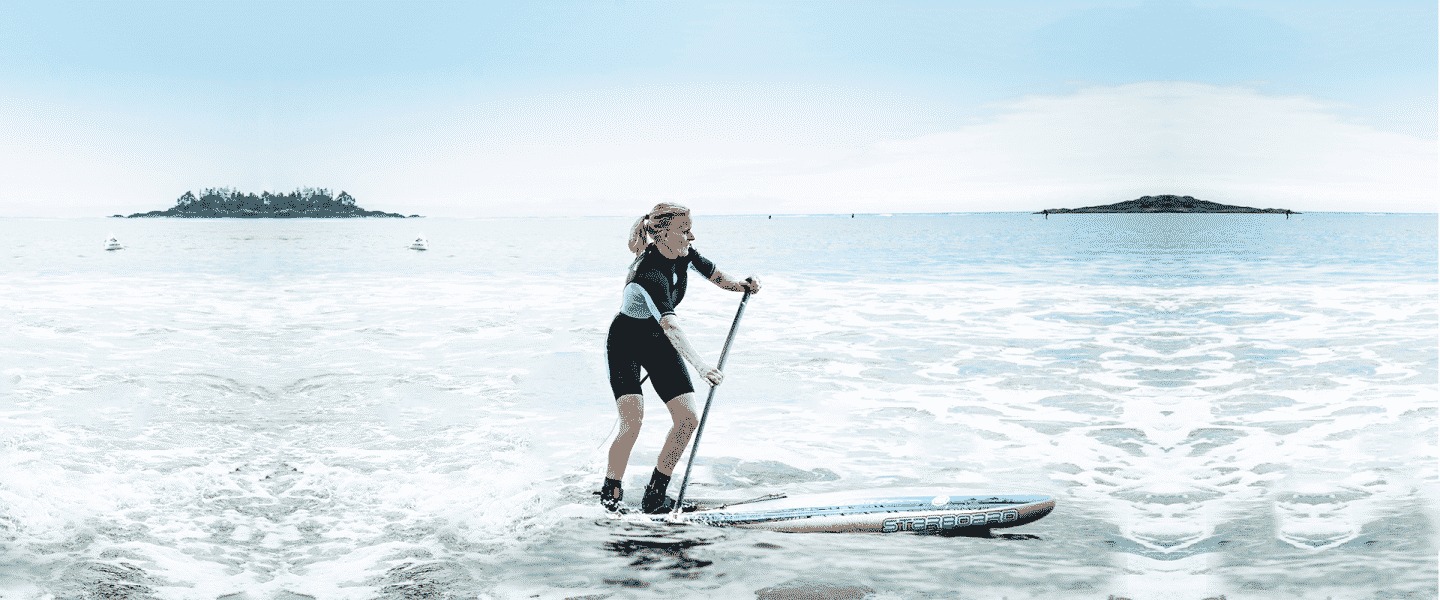 a person riding a surf board on a body of water