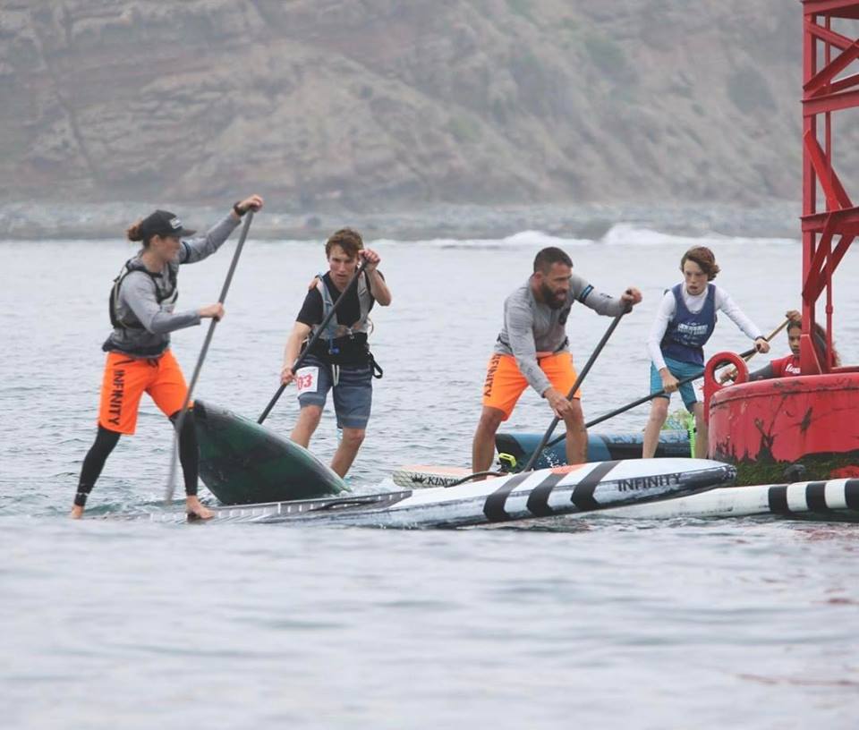 a group of people riding on the back of a boat
