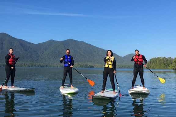 a group of people that are standing in the water