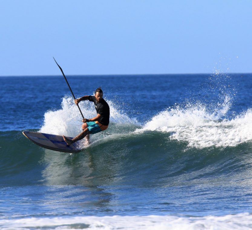 Resized_IMG_20210131_124412_538_1407277432902488 a man riding a wave on a surfboard in the ocean