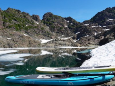 a boat sitting on top of a mountain