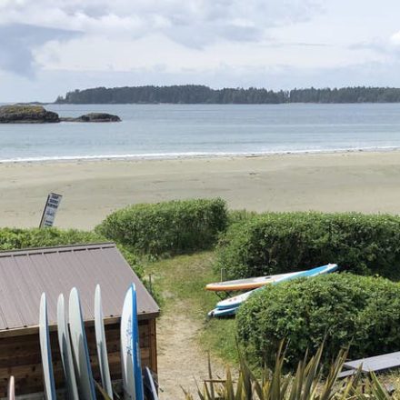 a wooden bench next to a body of water