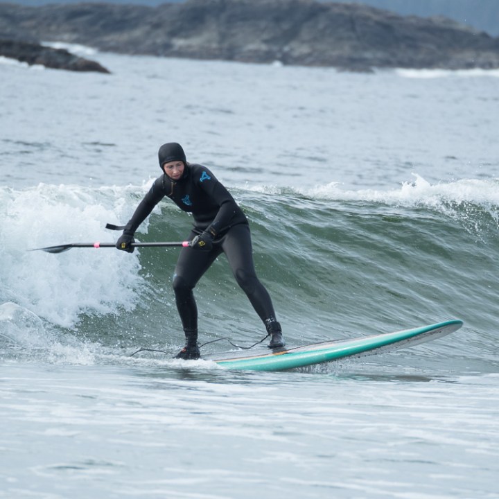 a man riding a wave on a surfboard in the ocean