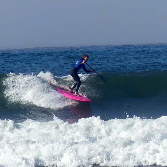 a man riding a wave on a surfboard in the water
