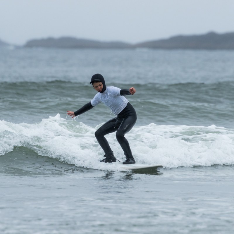 a man riding a wave on a surfboard in the ocean
