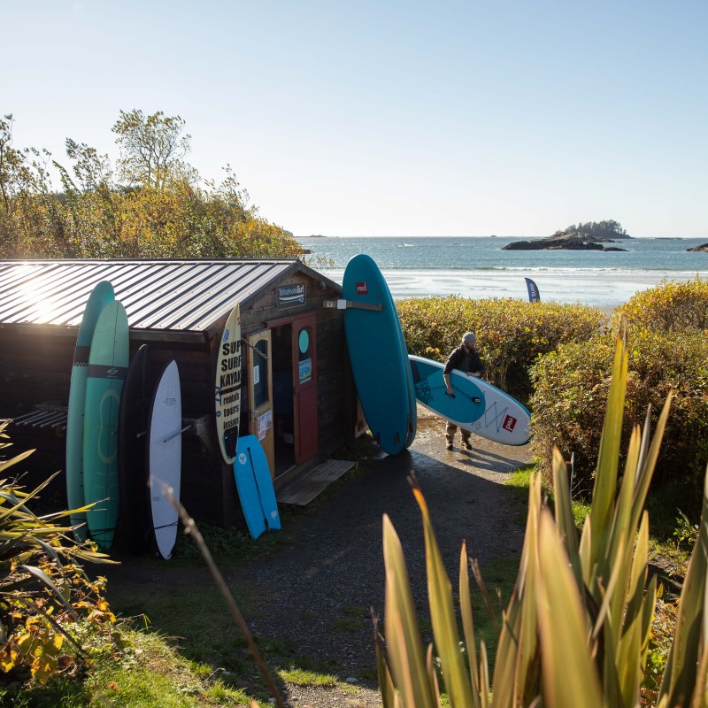 a group of lawn chairs sitting on top of a body of water