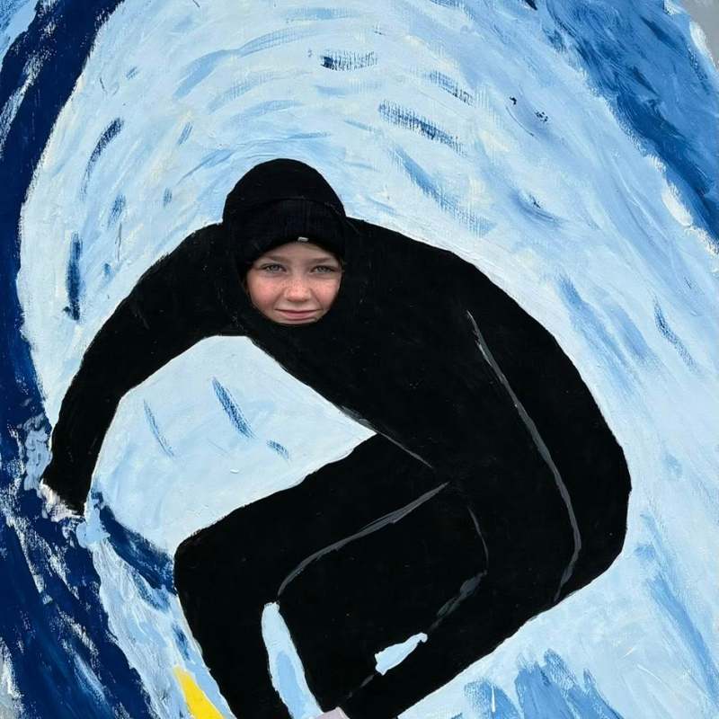 a man that is standing in the snow